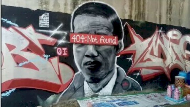 Mural sesosok yang disebut-sebut menyerupai Presiden RI Joko Widodo. (Foto sebelum dihapus).