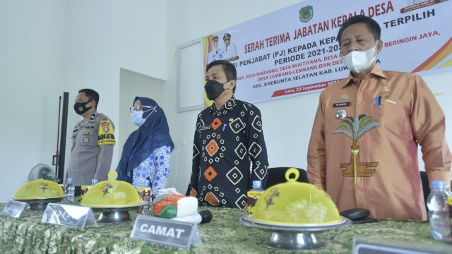 Sekretaris Daerah (Sekda) Luwu Utara, Armiadi, menghadiri acara Serah Terima Jabatan (Sertijab) Kepala Desa (Kades) dari Pjs Kades kepada Kades Terpilih Periode 2021-2027 di Aula Kantor Camat Baebunta Selatan, Kamis (23/9/2021). 